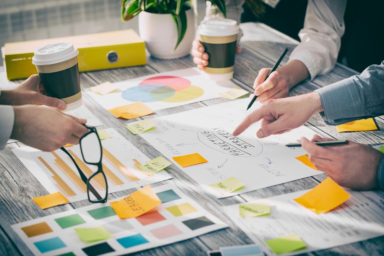 different color swatches spread out on work desk, level strategy,  sales and marketing plan