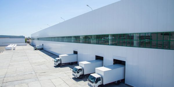 Distribution Center with Trucks parked in the shipping Dock