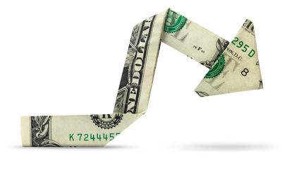 Dollar bill folded into a arrow