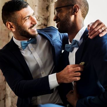 Grooms embracing a sensual moment after ceremony