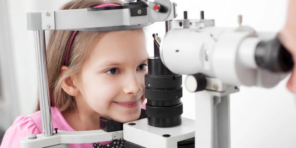 child getting an eye health check up