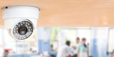 Picture of a camera in a room full of people