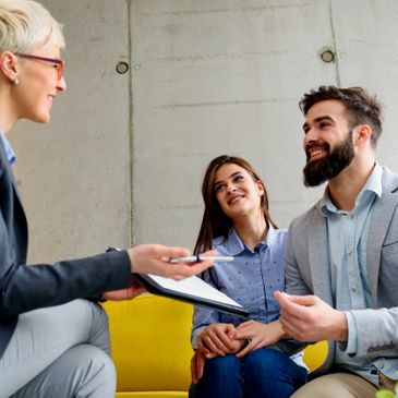 A couple on a journey of wellness meeting with a psychologist.