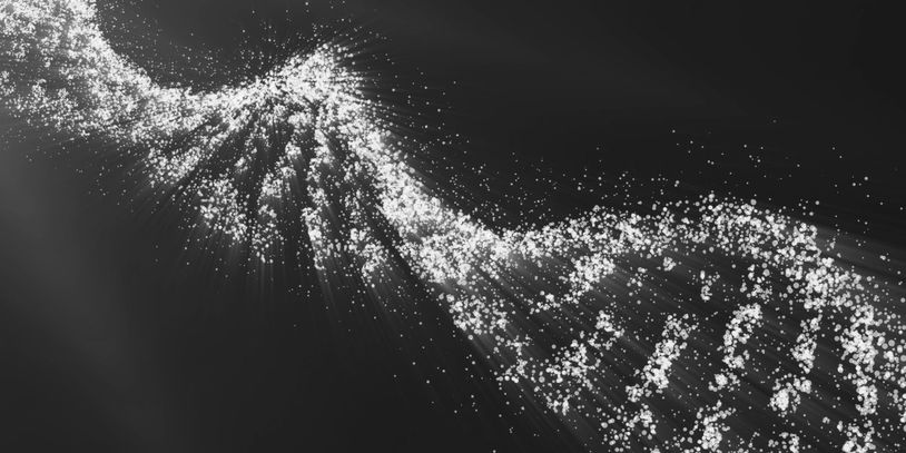 Glowing blue DNA double helix composed of scattered particles on dark background.