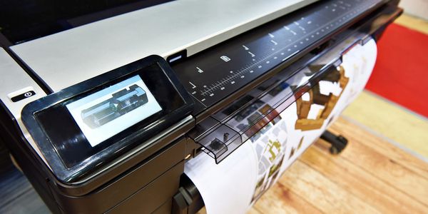 A printing machine printing an architectural plan