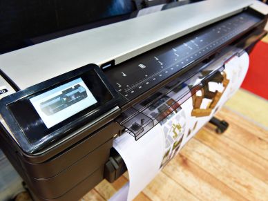 Large format printer printing detailed images.