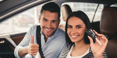 Driver and passenger smiling 
