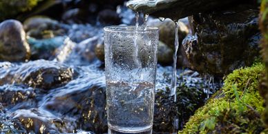glass of water near river