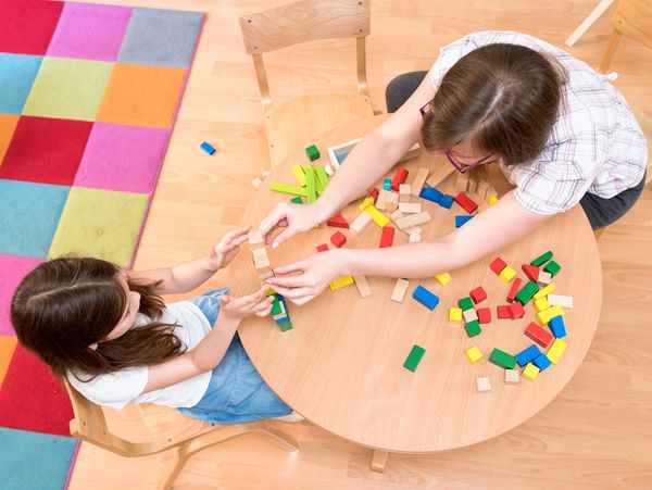 Children playing with wooden blocks