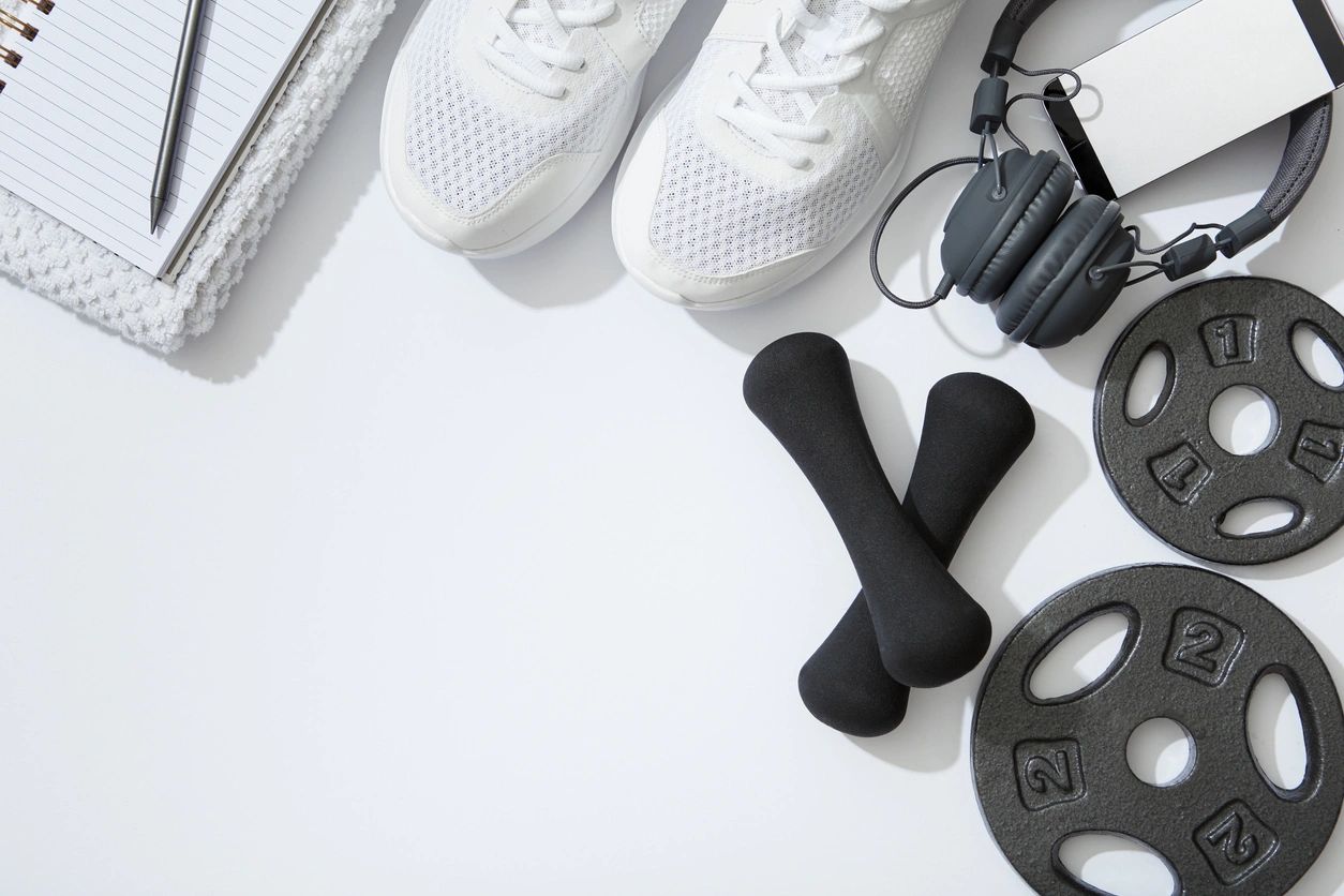 workout equipment such as weights, headphones, and running shoes