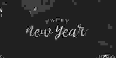 Fireworks going off with the words "Happy New Year".