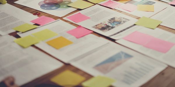 An image of pictures and sticky notes on top of the pictures.
