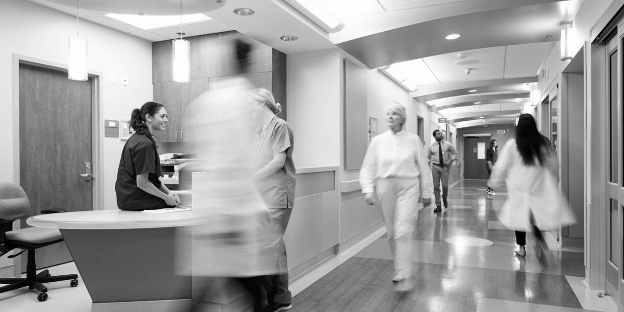 Hospital Corridor showing surgeons and nurses busy careing for patients