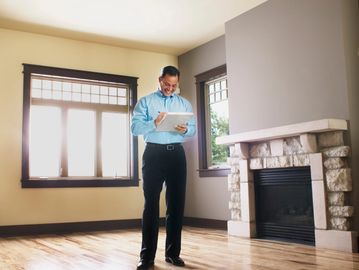 man inspecting home