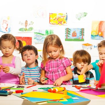 Group of preschool children doing arts and craft