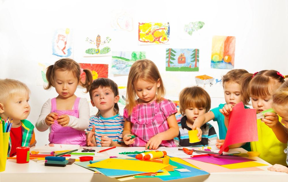 Preschoolers doing crafts at a table