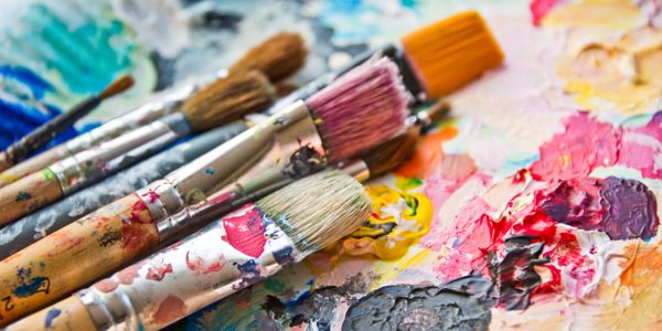 paint covered pallet with brushes for Paint it Priti