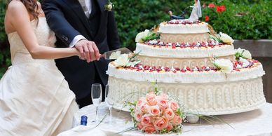 A Bride and Groom Cutting a Wedding Cake