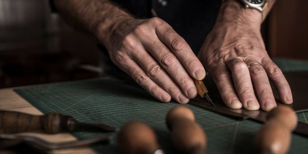 Leather craftsman making leather goods