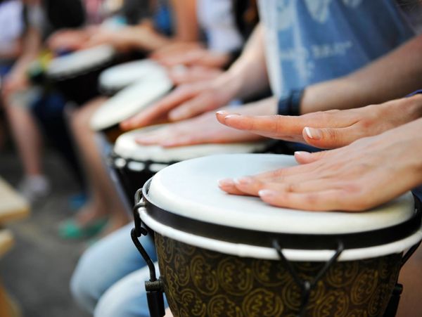 people drumming together in music therapy