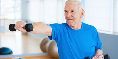 an old man using dumbbells