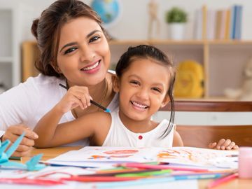 Teacher and student smiling