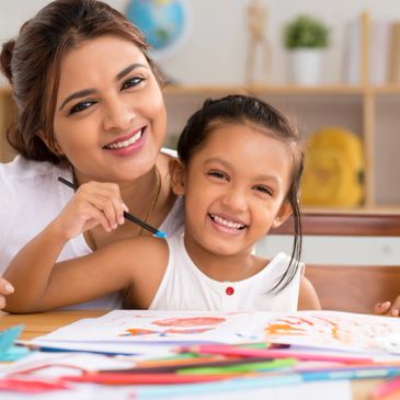 Behaviour Interventionist teaching child with Autism play skills.