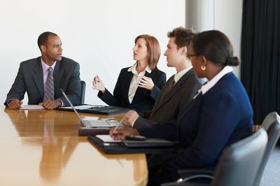 Group of colleagues in a roundtable discussion.