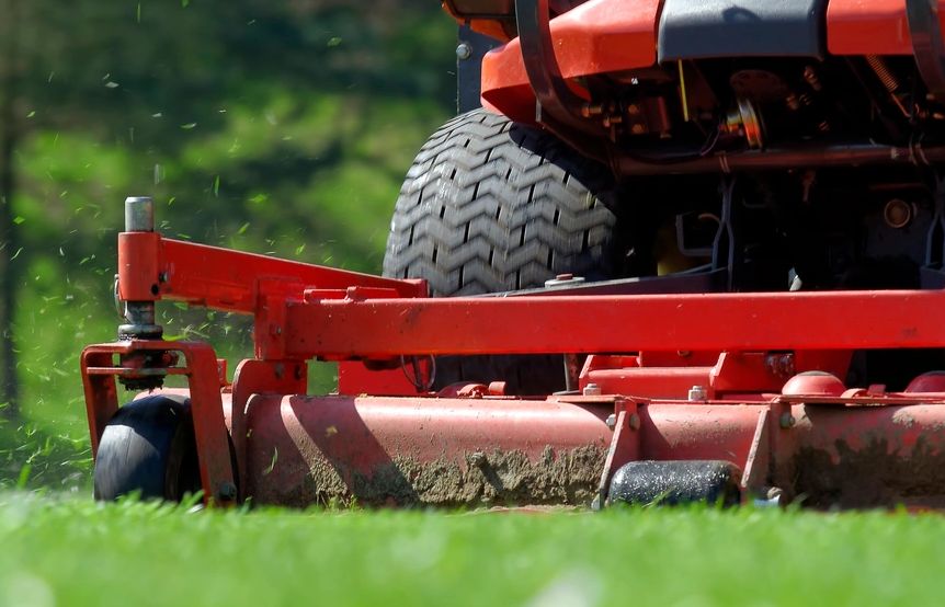 Lawn mower cutting grass