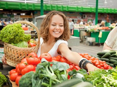 A woman shopping for vegetables