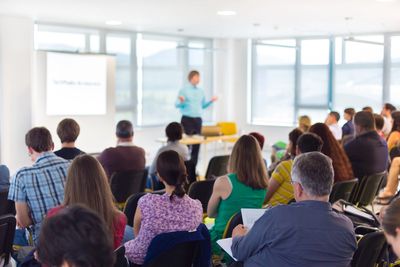 roomful of people listening to an instructor