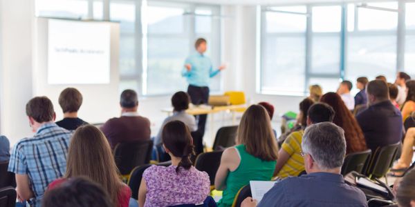 Speaker leading a full training class