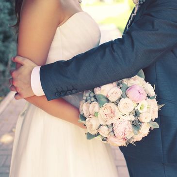 Couple embracing  in wedding attire