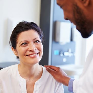 a doctor talking to a lady patient