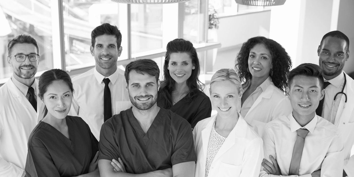 A diverse team of medical professionals united in providing compassionate, quality healthcare.