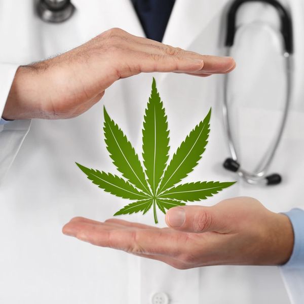 doctor with hovering cannabis leaf