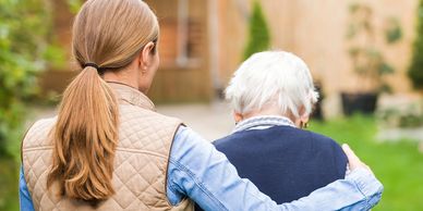 Senior and Daughter walking