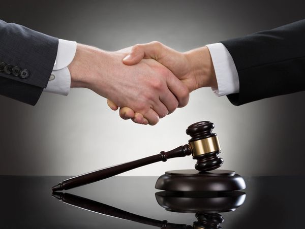 Two men shaking their hands