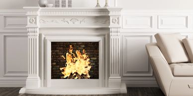 Intricate wall frame moulding around a fireplace.