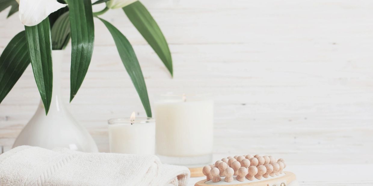 Spa background with a flower plant, towels and candles
