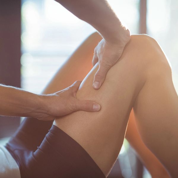 experienced physiotherapist in cobham applies manual therapy  and myofascial release to injured hip