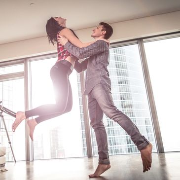 Man and woman dancing in apartment