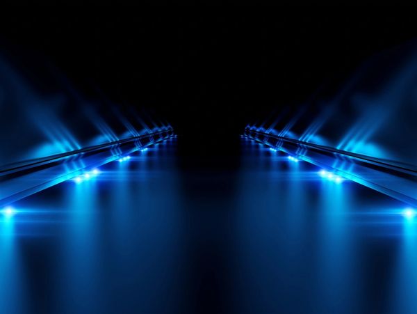 Futuristic pathway illuminated by blue LED lights in a dark environment.