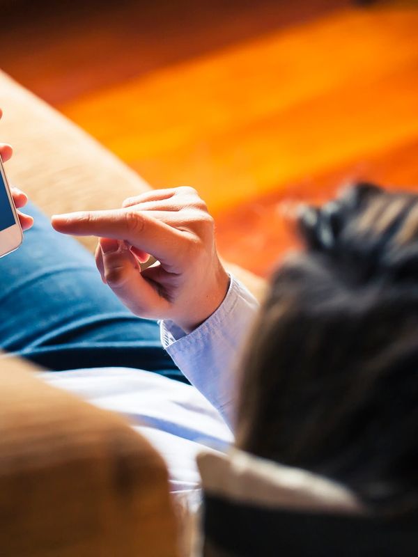 Patient in Nevada booking a virtual telehealth appointment on a smartphone.
