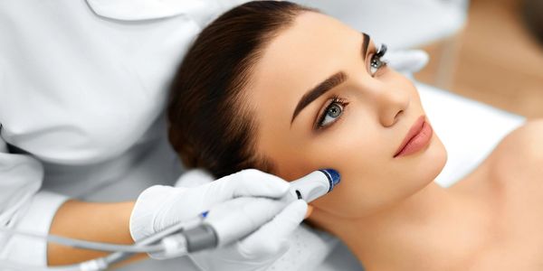 A doctor giving face massage on a lady face