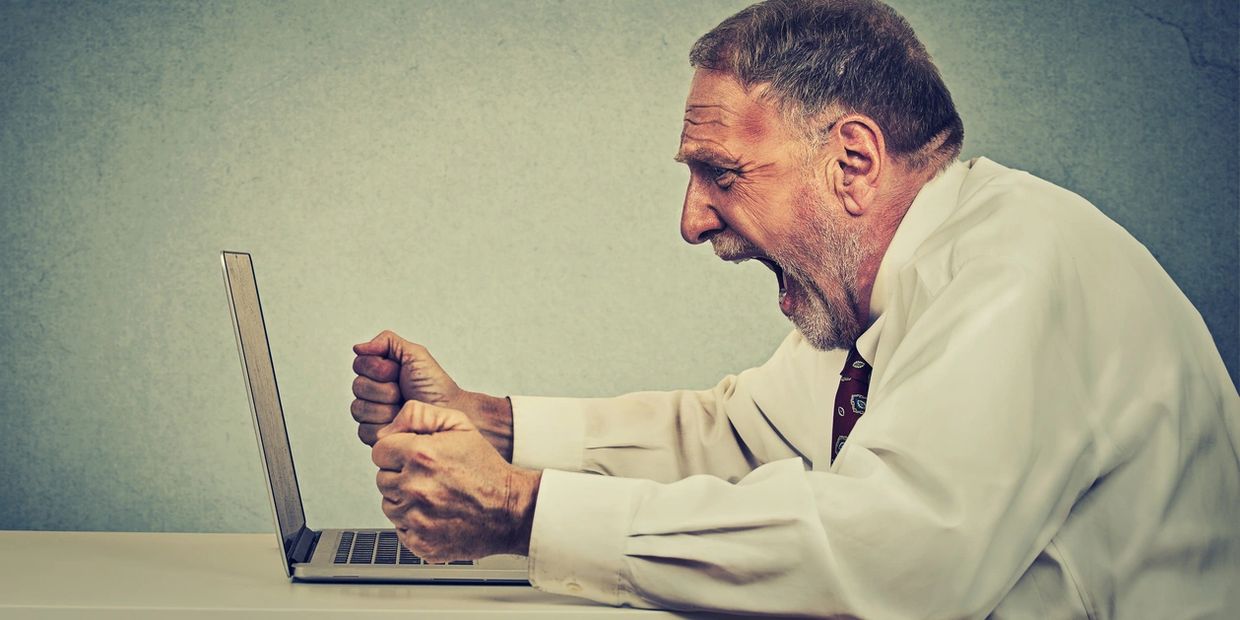 Angry business man or business woman from virus or malware or application failure