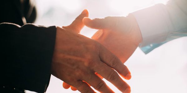 Handshake showing how we partner with our clients.