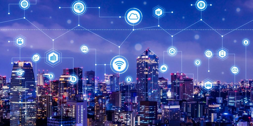 City skyline with digital technology icons connected.