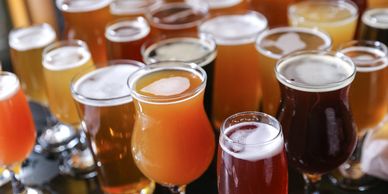 Variety of craft beers served in different glassware.