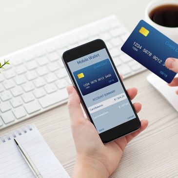 Person using mobile wallet app with credit card.